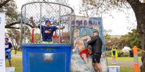 Peter being dunked in ice cold water by his grandson