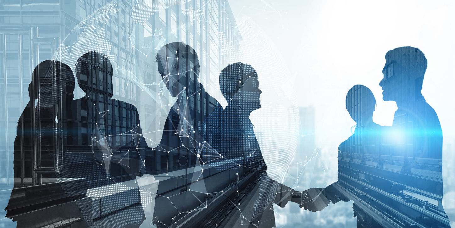 Silhouette view of business people team in group meeting on city office building background showing partnership success of business deal. Concept of teamwork, trust and agreement.